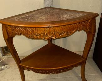 Corner table with marble inlay