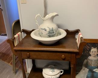 Antique dry sink - pitcher and bowl - and a chamber pot. Explain that to your kids - it will totally freak them out!
