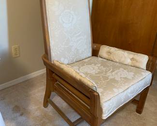 Mid Century style upholstered chair with caning on arms