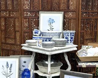 Beautiful Asian screen, lots of blue - art, vases, plates, and more, shabby chic table, woven trays, framed botanicals, rug runner with muted colors.