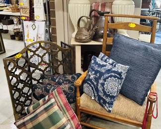 Handsome neutral lamps, brass fireplace screen, pillows, and more