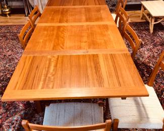 Teak extension dining table, marked AM Made in Denmark, comes with 8 Svegards Markayrd teak chairs