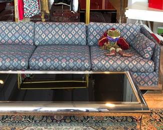 Black and chrome coffee table, chrome framed Mod sofa, 1 area of wear on the back as pictured 2 pics ahead