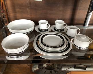 Studio international sophistication pattern, Japan Service for 12: includes dinner plates, lunch plates, soup bowls, cups and saucers, 1 sugar and creamer, 1 serving bowl. Owned by a talented & popular local designer, who is downsizing.