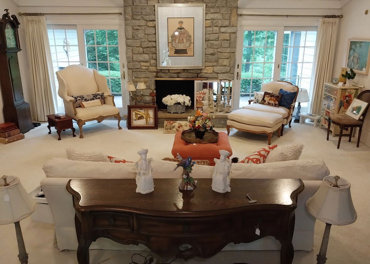 oversize wing back chair, oversize arm chair and ottoman, couch with ottoman, sofa table, Gordon Graham painted furniture, oriental figures and wall art, grandfather clock, silk flowers, lamps
