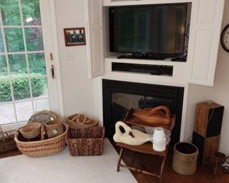 flat Samsung TVs, boom boxes, sound bar, baskets, wooden geese, crock