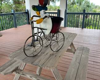 Metal yard art
Dog riding a bike