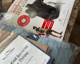 Several new in package items - blankets, heating pad wrap, pedicure kit (plus more)