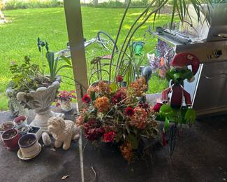 Lots of potted plants, greenery, patio furniture, and more!