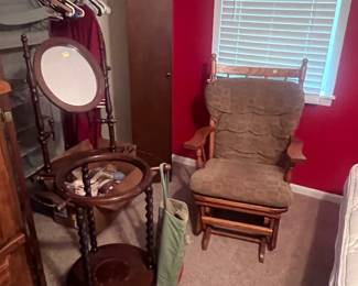 Located in red bedroom. This is a washstand and glider rocker.