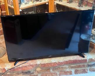 Located in the living room next to fireplace. This is a 40" flat screen Samsung tv.