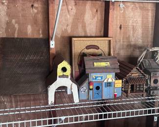 Located in the garage. Decorative birdhouses.