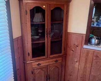 This corner china cabinet is located in the dinning area. It has been sitting in this corner since the house was built in 1975. It in very good condition.