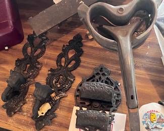 Located in garage. Cast iron candle and match holders. Vintage grader. Collectable travel pieces.
