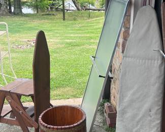 Located in garage. Oak container, two ironing boards, and a sliding shower doors.