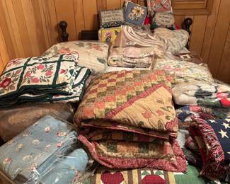 Hand made quilts and a full size bed