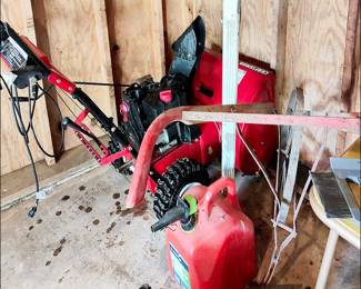 Gas powered snow blower.