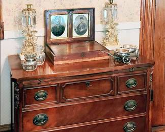Mahogany Server with Victorian Framed Roses behind. Gilded Prism Figural Candle Holders, Antique Writing Box, Sterling Deposit Jars, Silver Wine Trolley