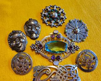 Group of sterling silver pins and brooches
