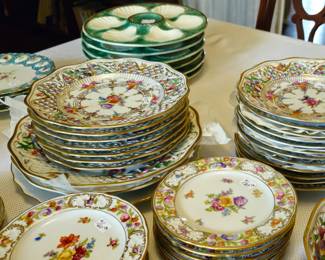 Dresden Empress Garden with pierced rims in three sizes. Additional dessert plates with traditional rims.