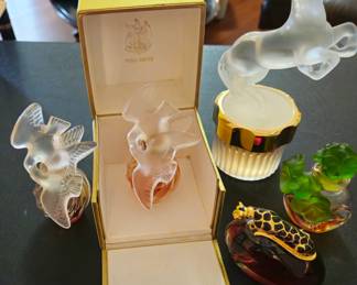 Lu Aire du' Temps in Lalique bottle and fitted original box. 2002 Limited Edition Cheval Horse Eau de Parfum in Lalique bottle. No box found. (Also known as Phoenix Mascot"). "Glamour" by Gale Hayman in leopard top bottle, and Cabotine de Gres with green crystal flower clusters.