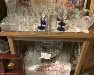 Decanters and beautiful punch bowl with stand and cups.