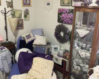Pretty chase lounge.
Curio cabinet with violet dishes.