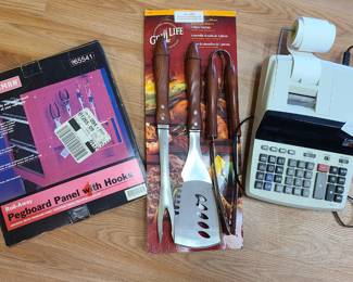 calculator, shelf, grill tongs