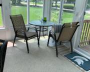 outdoor patio chairs and glass top table