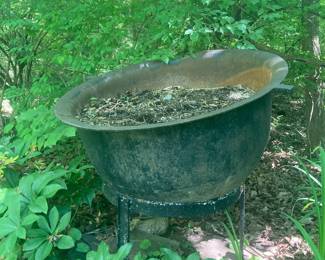 large iron Cauldron on stand