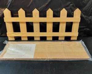 Decorative picket fence with instruction book, and hangers on the back.