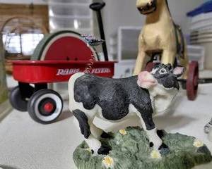 Cow with a fly on its backend, very cute piece.