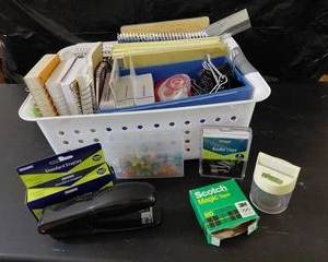 Office supplies, tables, clips, tacks, stapler, staplers, and more. Container included.