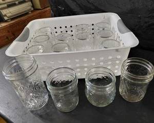 Basket of jelly jars, & 3 other jars included. No lids included.