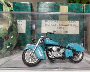 Toy Indian Motorcycle in plastic container.