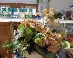 Artificial Flower Arrangement in White Bowl.