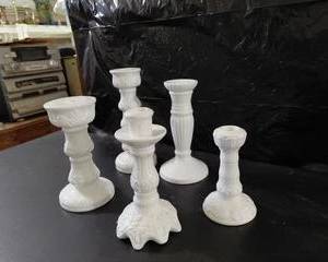 White Candle Sticks all different heights, patterns, very nice.