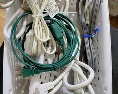 Container of Clean Misc. extension cords, surge protectors, and other types of cords.