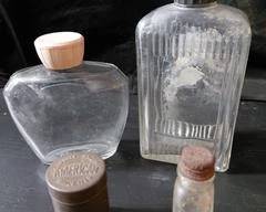 Vintage Avon, Jergins and small unknown bottles and a small snuff tin, no cracks, chips or other issues, all have lids.