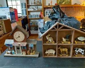 Country Store Clock and a Farm Animals in Housed Squares-Rabbit, Chicken, Duck, Pig, Horse, & Cow, all with pull strings attached. Brand New Condition. Perfect to teaching young ones about different animals or a great decorative item for a country home.