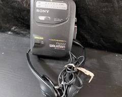 Sony Walkman Fm/AM Radio/Cassette FX301/303 with headphones, battery operated.