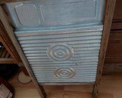 Antique washboard, metal wood frame.