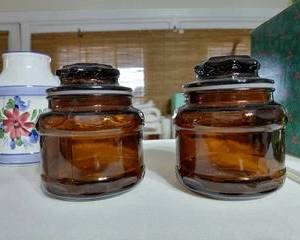 Small Amber Jars with lids, no chips, or cracks.
