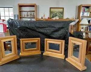 4 Blond wood picture frames 5x7, one of the frames has a broken glass, otherwise, all in good condition.