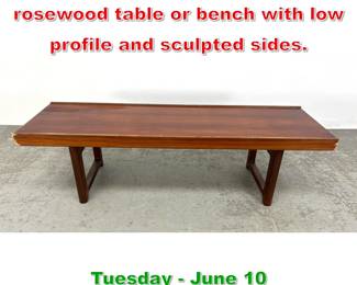 Lot 946 Torbjorn Afdal for Bruksbo rosewood table or bench with low profile and sculpted sides.