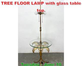 Lot 843 ITALIAN GILT METAL PALM TREE FLOOR LAMP with glass table top.
