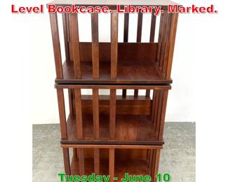 Lot 601 LEVENGER Revolving TriLevel Bookcase. Library. Marked.