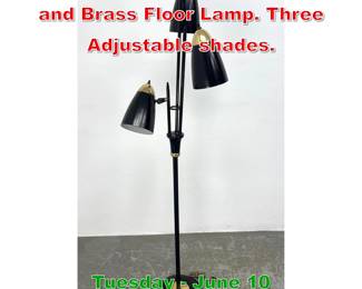 Lot 847 Mid Century Modern Black and Brass Floor Lamp. Three Adjustable shades.