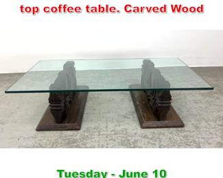 Lot 653 Brutalist Witco style glass top coffee table. Carved Wood