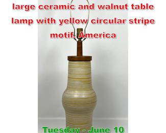 Lot 484 Gordon and Jane Martz large ceramic and walnut table lamp with yellow circular stripe motif. America
